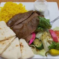 Gyro Plate · Thinly sliced gyro, a blend of lamb and beef, layered on a spinner, freshly carved and serve...