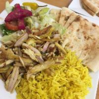 Chicken Shawarma Plate · Natural chicken thinly sliced, marinated in a house blend of spices, layered on a spinner, f...