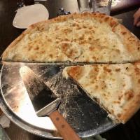 White Delight Pizza · A Rocco classic with ricotta, fresh garlic, and mozzarella cheese.