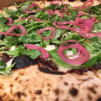 Triple P Pizza · Fresh mozz, pancetta, goat cheese, fig jam, mushrooms, arugula and picked red onions.