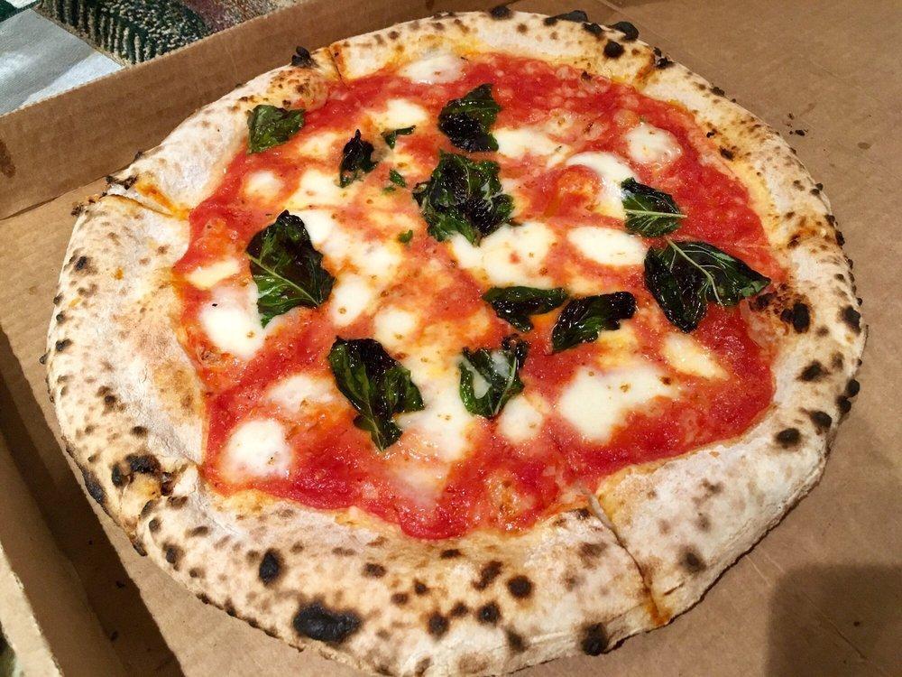 Mary Margherita Pizza · Basil, fresh mozzarella, garlic oil, and sauce. Vegetarian.