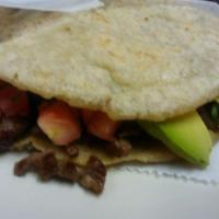 Gordita · Handmade corn dough sandwich stuffed with your choice of meat or veggie
beans, onions, cilan...