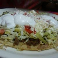 Huarache · Sopes bigger cousin your choice of meat topped with beans, lettuce, tomato,
onion, sour crea...