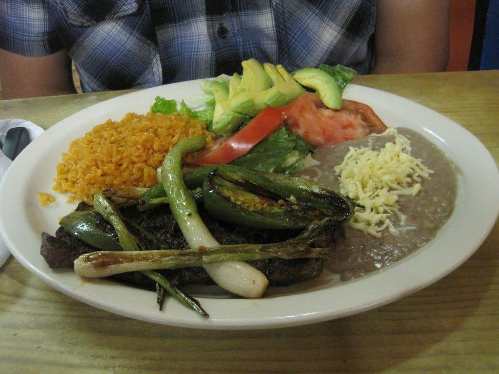 Carne Asada Dinner · Skirt steak with grilled baby onions, grilled jalapeno, avocado slices and salad.