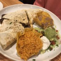 Quesadilla · Crispy, flour tortilla stuffed with cheddar and monterrey Jack cheese. Served with onions, t...