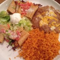 Flautas · 3 crispy, flour tortillas filled with shredded beef and pork or chicken and topped with toma...
