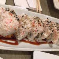 White Dragon Roll · Shrimp tempura, avocado, cucumber, cream cheese topped with crab, unagi sauce & chipotle cre...