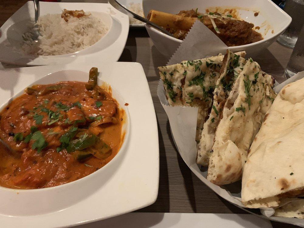 Chicken Tikka Masala · Boneless chicken cubes marinated overnight in ginger, garlic, select spices & yogurt, cooked in a tandoor oven, and simmered with creamy tomato curry sauce.. (mild option). Served with rice.