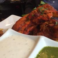 Tandoori Chicken · Hung yogurt, ginger, garlic and spices. From the Grill. Tandoor items preparation time ~25 m...