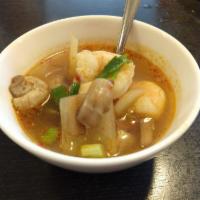 Tom Yum Noodle Soup · Shrimp, chicken and calamari with bean sprout, onions, Thai herbs with spicy hot and sour so...