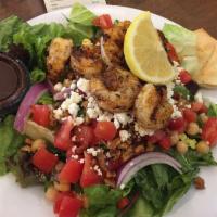 Mediterranean Salad · Fresh mixed lettuce with garbanzo beans, roasted red peppers, red onions, diced tomatoes, ca...