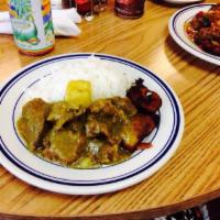 Curry Goat · Goat meat seasoned with Jamaican curry and herbs and spices then stewed until tender.