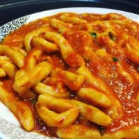 Homemade 8 Fingers Cavatelli · Served with rapini and crushed red pepper in garlic and oil.