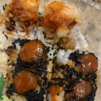 Black Jack Roll · Spicy tuna, shrimp tempura and avocado underneath black caviar touched with chili paste and ...