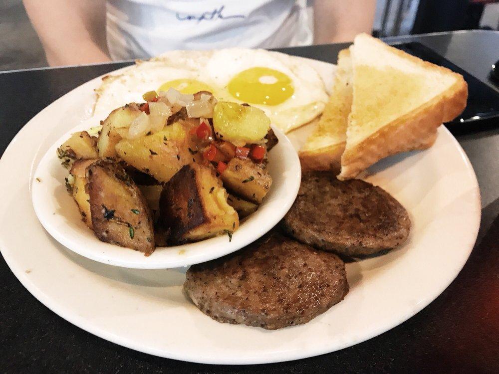 Southern Breakfast · 2 eggs any style with your choice of: pork bacon or chicken sausage or pork sausage or turkey bacon and your choice of grits or breakfast potatoes with your choice of biscuit, white or wheat toast.