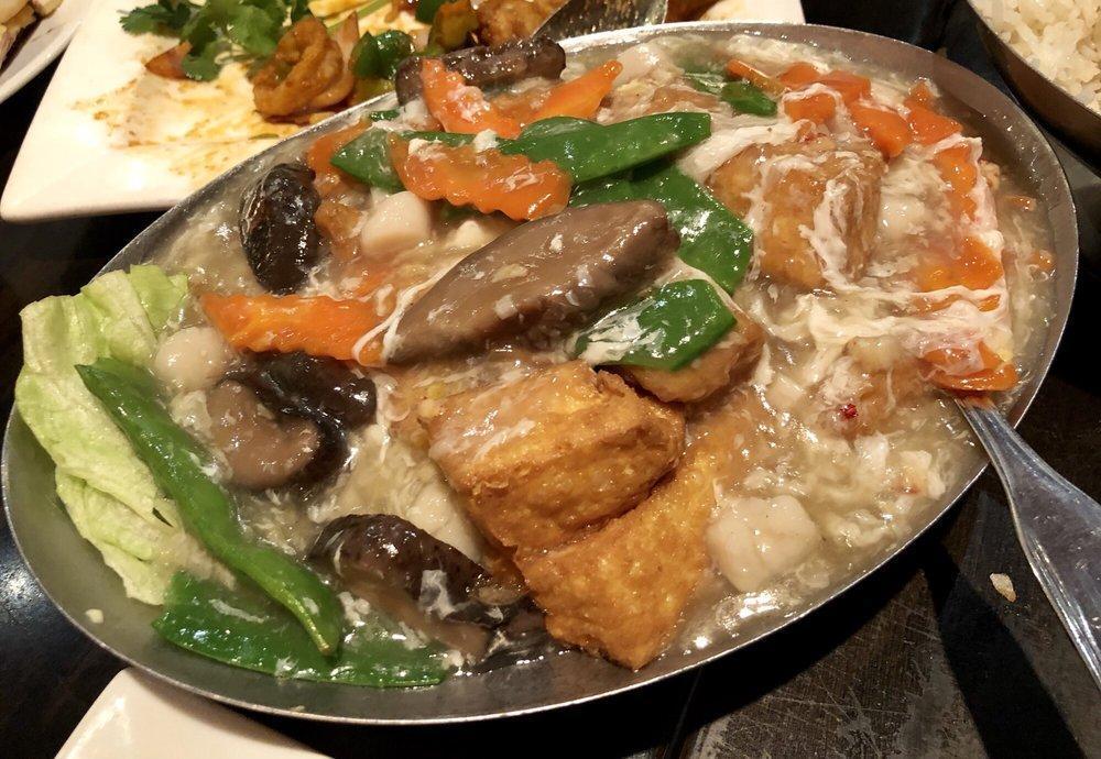 Penang Tofu · Soft silky tofu with chinese mushrooms, carrots, snow peas, and scallops in lobster sauce.