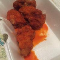 Buffalo Wings · 8 pieces. Cooked wings of a chicken coated in Buffalo sauce. 