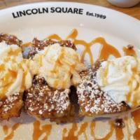 Cinnamon French Toast · A tasty cinnamon roll sliced, battered & topped with candied pecans, caramel sauce, dusted w...
