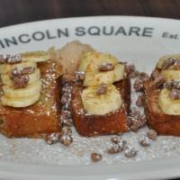 Banana Bread French Toast · Delicious banana bread dipped in French toast batter topped with bananas, pecans, caramel sa...