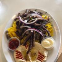 Gyro Plate · Sliced lamb & beef gyro served on a bed of rice alongside a serving of house salad, tzatziki...