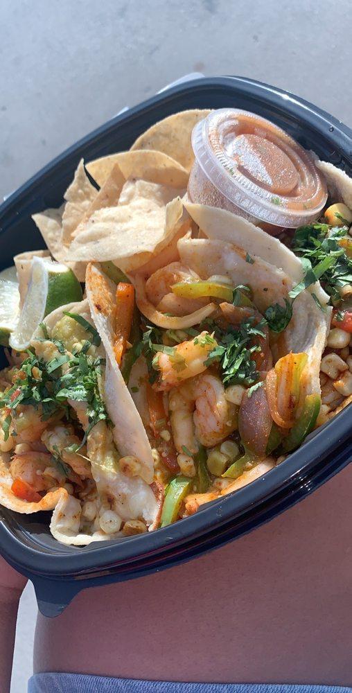 Shrimp Tacos · Blackened shrimp, corn, sauteed onion, bell pepper, Jack cheese, and cilantro. Served with choice of corn or corn tortilla and chips and salsa.