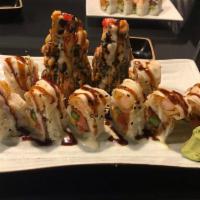 Bonsai Tree Roll · Spicy tuna, cream cheese and shrimp rolled then flash fried and topped with red and black to...