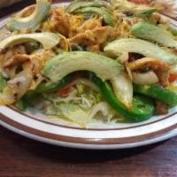 Fajitas · Choice of chicken, steak or prawns served sizzling hot over a bed of sauteed onions and gree...