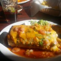 Wet Burrito · A flour tortilla filled with your choice of meat, rice, rancho beans, guacamole and sour cre...
