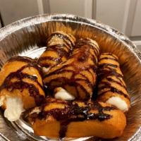Cannoli · La rosa cannolis shells and cream shipped from new jersey topped with powdered sugar, chocol...