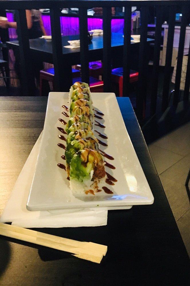 Dragon Roll · Shrimp tempura, cream cheese, spicy mayo, asparagus, avocado. Topped with eel sauce.