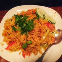 Pineapple Fried Rice · Stir fried rice with chicken, egg, onions, pineapple, cashew nut, green onions and carrots a...