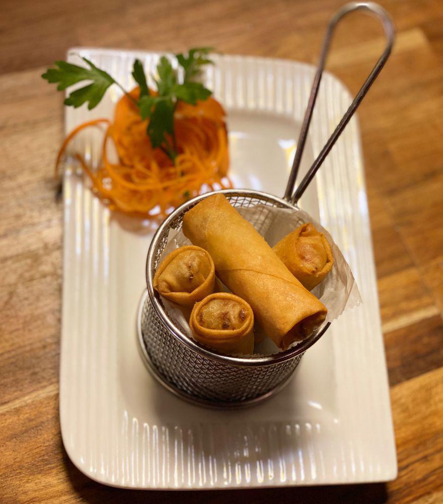Thai Spring Roll · Fried vegetable rolls stuffed with mix veggie and glass noodle served with sweet chili sauce.