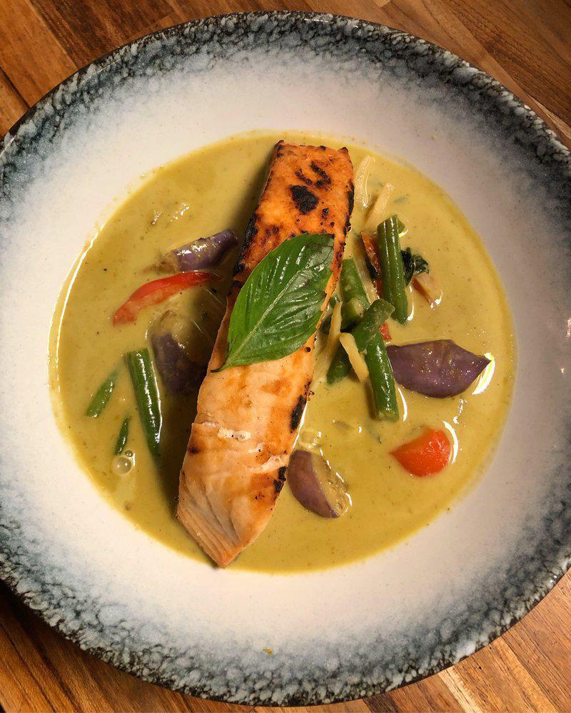 Green Curry · Curry dish with hot and light sweet curry sauce in the mix of coconut milk, eggplants, bamboo shoots, basil leaves and red bell peppers. Spicy.