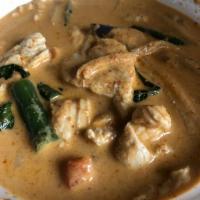Red Curry · Delicious curry dish with red creamy coconut milk with hot red chili paste, eggplants, bambo...