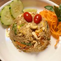 Pineapple Fried Rice · Delicious fried rice with cashew nuts, tomatoes, Hawaiian pineapple chunks and egg with soy ...