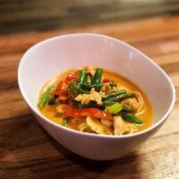 Panang Curry · Slightly red smooth creamy sweet and spicy curry with pineapple, string beans, carrots and k...