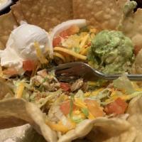 Fajita Taco Salad · Beef or chicken topped with guacamole and sour cream.
