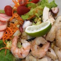 Seafood Salad · Ginger dressing. Served with romaine lettuce, grape tomato, stringed carrot and strawberry s...