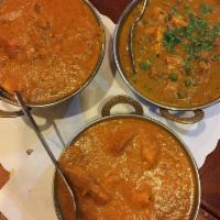 Butter Chicken · Tandoor-cooked chicken in creamy tomato sauce with butter, cream, yogurt and house masala. S...