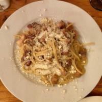 Spaghetti Carbonara · Smoked pancetta, organic eggs, pecorino Romano cheese, cracked black pepper and parsley.