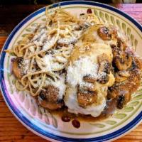 Pork Chop · Stuffed with mushroom, prosciutto, Fontina cheese in Madeira sauce with pasta.