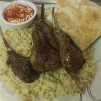 Lamb Ribs Plate · Plate will include 4 pieces of lamb ribs rice pillow 3 pieces of Peter bread is the Peter br...