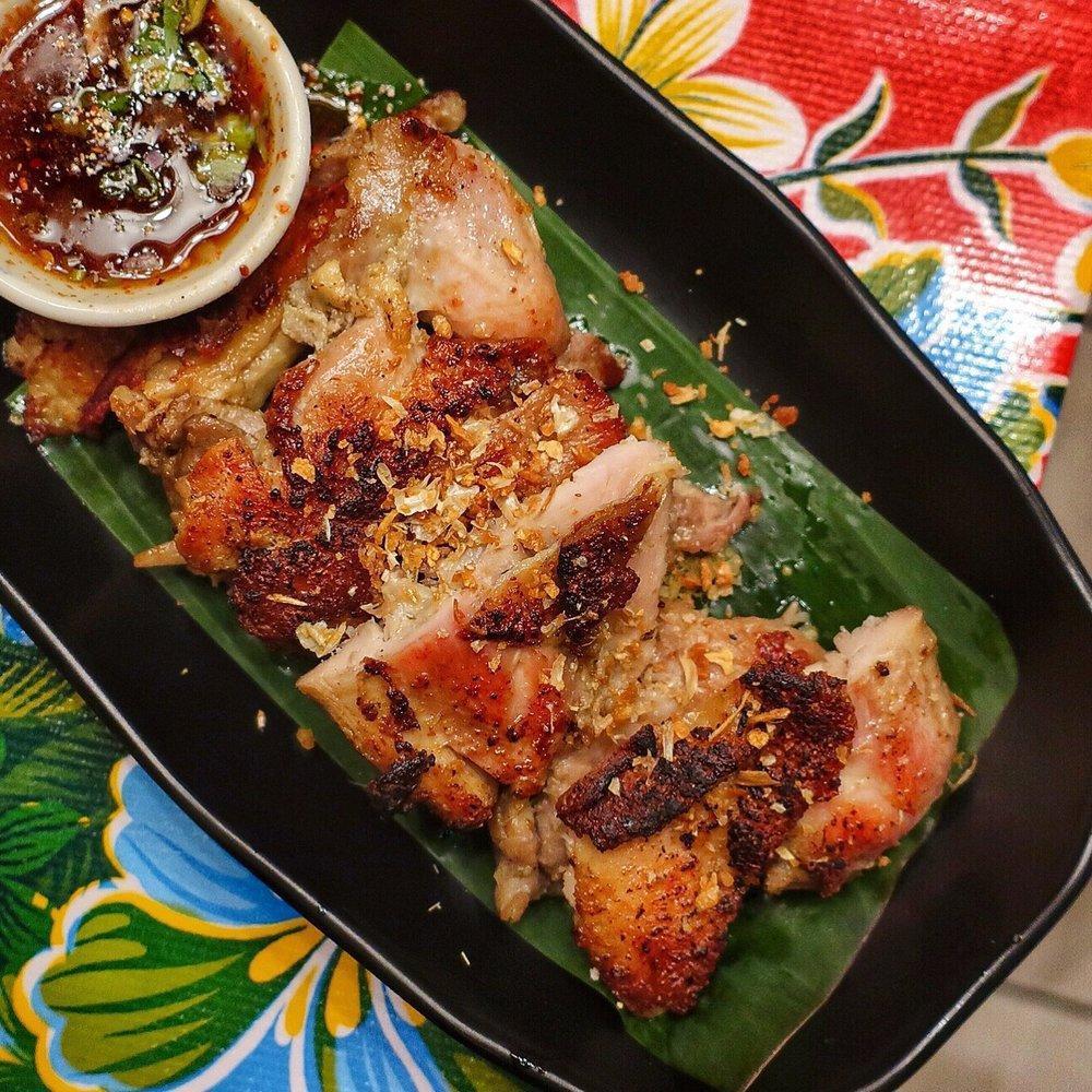 Gai Yang · Grilled Herbs Chicken served with sticky rice and Jaew sauce.
