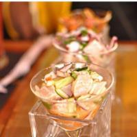 Ceviche · Served with white fish, octopus and shrimp, red onions and cilantro marinated in fresh squee...