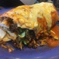 Gringo Burrito · Seasoned ground beef, rice, black beans, cheddar, lettuce, tomato, crema, queso fundido, and...