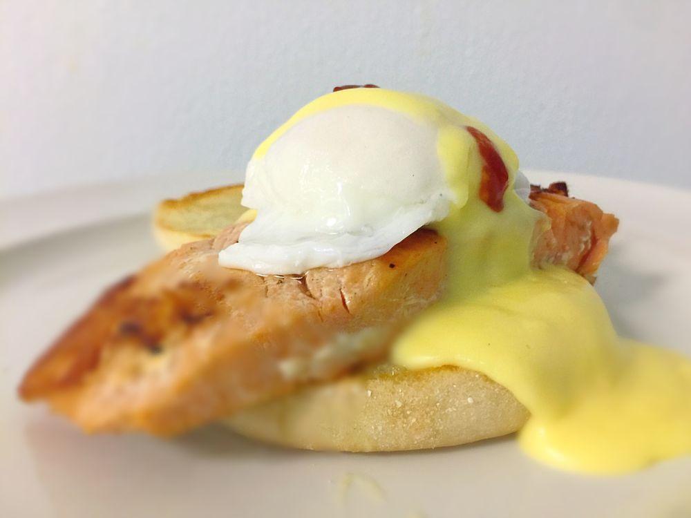 Salmon Egg Benedict · Grilled salmon, over easy poached eggs, English muffin top with bearnaise sauce. Served all day.