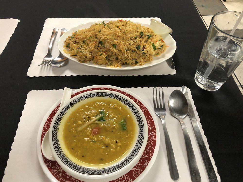 Chicken Biryani · Basmati rice and a touch of curry sauce.