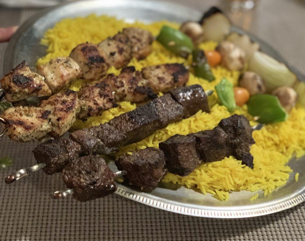 Family Size Shish Kebabs · Comes with 4 skewers of meat chicken, beef, lamb and kafta and veggie kebabs. Served with large rice and large house salad extra for Greek for an additional charge.