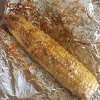 Elote Loco · Corn on the cob lightly coated with mayo and covered with Cotija cheese and dusted with chil...