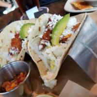 Street Tacos · Topped with freshly-made roasted tomato & corn salsa, shredded lettuce, avocado, fresh cilan...